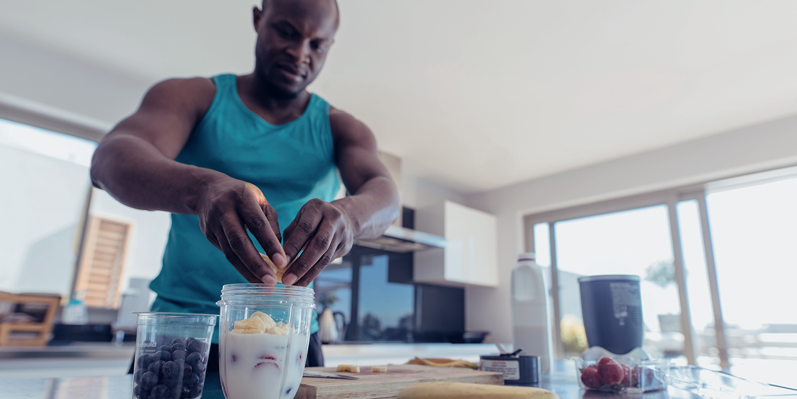 Photo of man prepping post workout smoothie