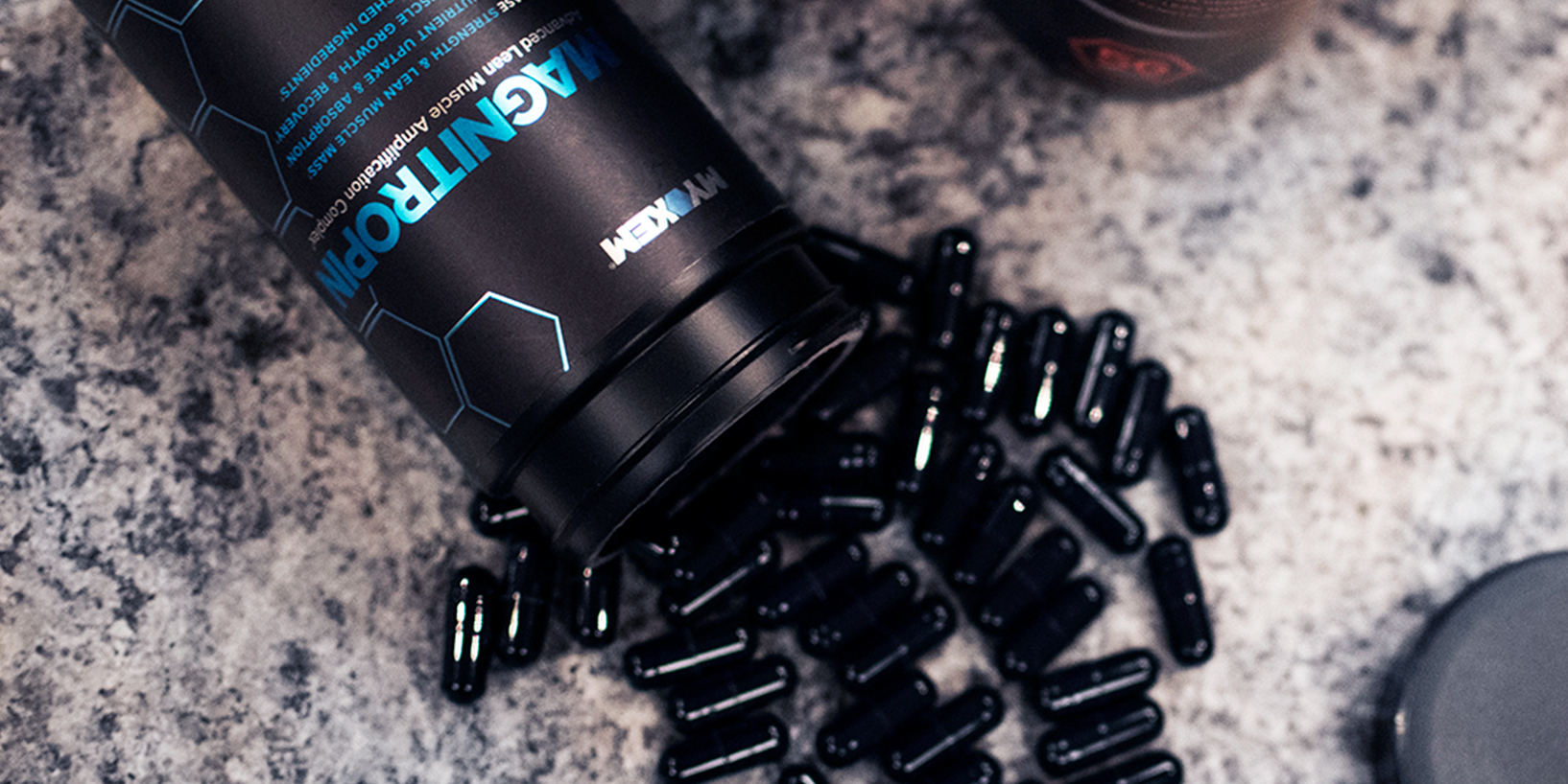 bottle of magnitropin testosterone booster spilling over