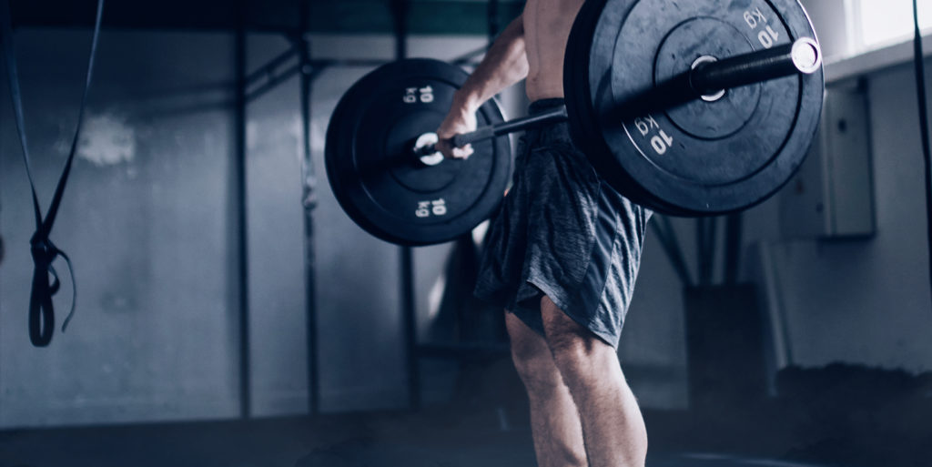 man lifting weights